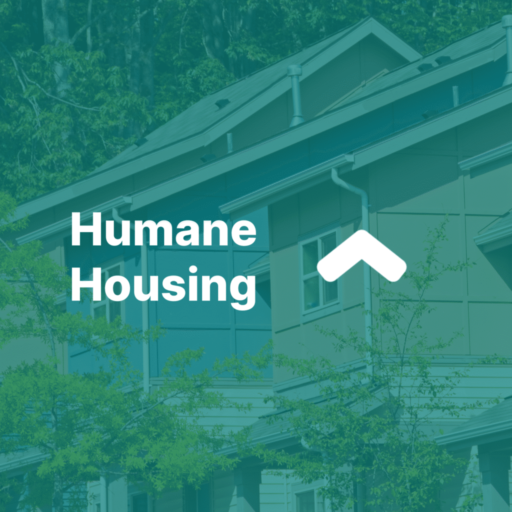 Dark green square that reads humane housing